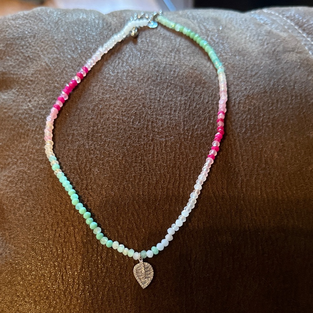 Elegant Beaded Necklace with Silver Leaf Pendant